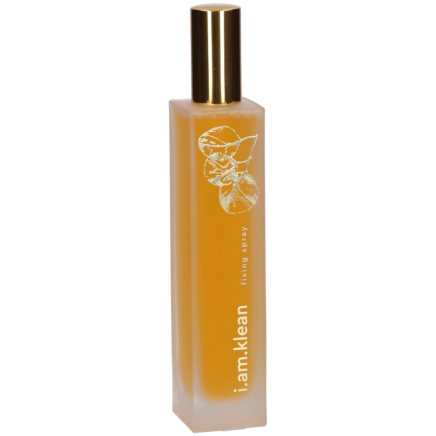 Flacon cylindrique avec vaporisateur doré. Inscription : i.am.klean, fixing spray. Liquide jaune visible.