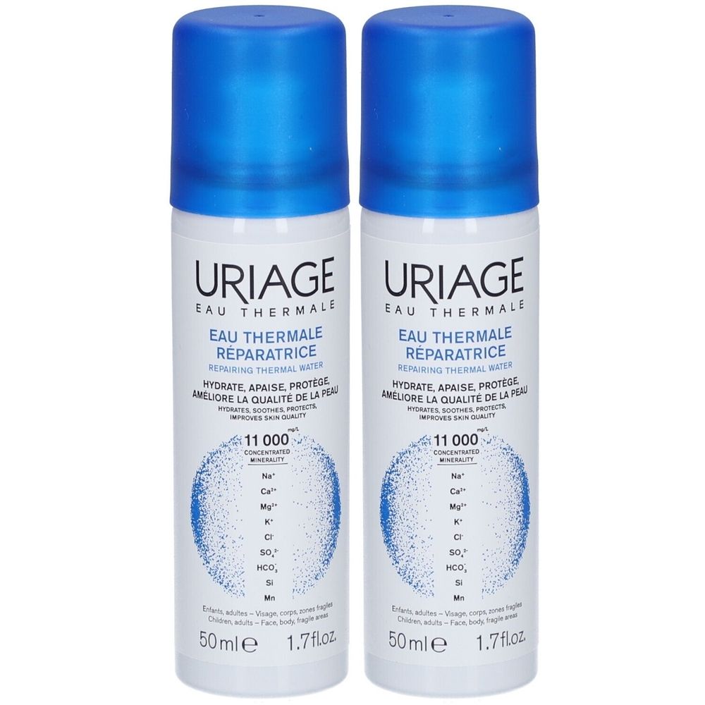 Deux flacons de spray Uriage Eau Thermale. Bouchons bleus, étiquettes blanches avec texte. Inscription: Eau Thermale Réparatrice, 50ml.
