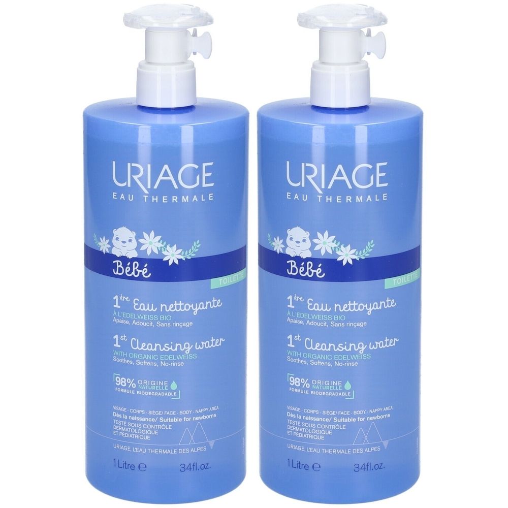 Deux flacons bleus avec pompe blanche. Inscription: URIAGE, Bébé, 1st Eau nettoyante, 1st Cleansing water. 98% Origine.