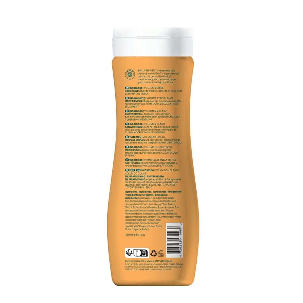 Shampoing Attitude Super Leaves Volume & Brillance, bouteille orange avec bouchon blanc et texte.