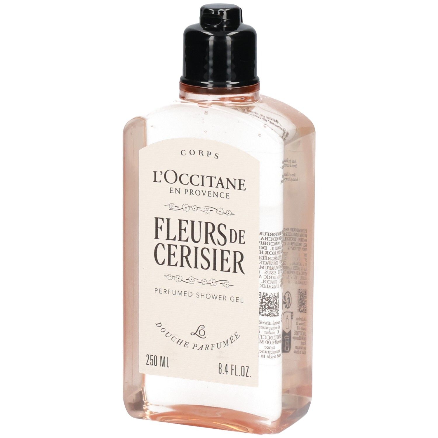 Gel douche L'Occitane Fleurs de Cerisier dans un flacon transparent avec bouchon noir.