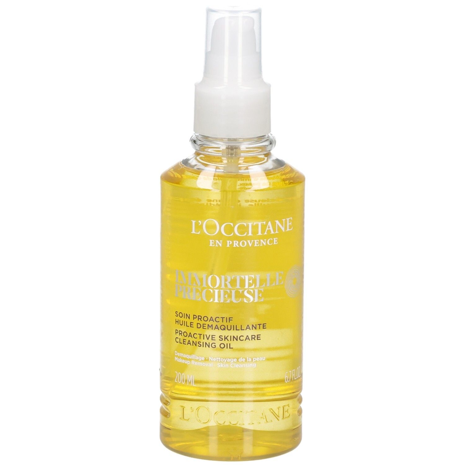 Huile démaquillante L'OCCITANE Immortelle dans un flacon pulvérisateur transparent avec une huile jaune.