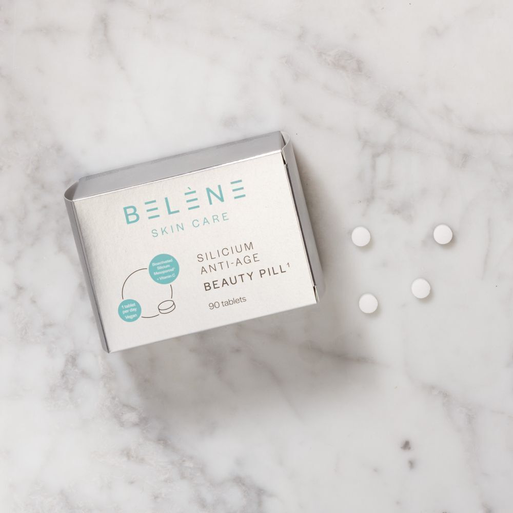 Boîte BELÈNE Skin Care Silicium Anti-Age avec comprimés. Inscription: Beauty Pill, 90 comprimés. Sur marbre.