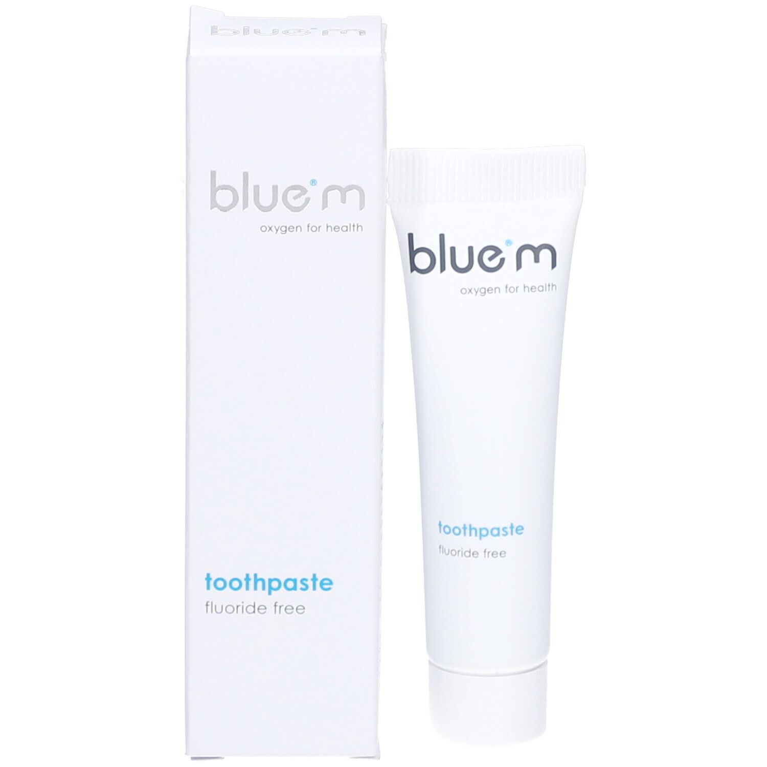 Tube de dentifrice et boîte. Inscription : blue®m, Zahnpasta Fluoridfrei. Boîte : oxygen for health.