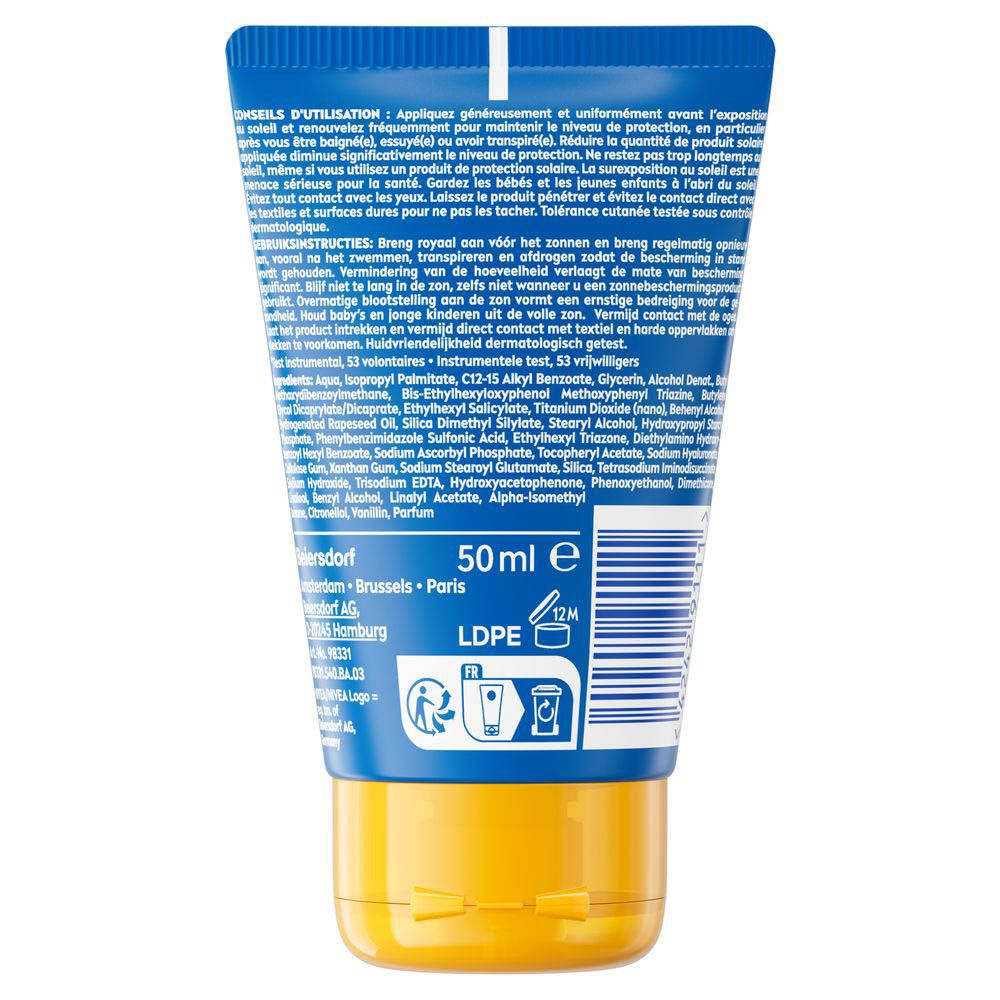Dos du tube bleu avec bouchon jaune. Texte en plusieurs langues. Contient des informations sur les ingrédients et l'utilisation.