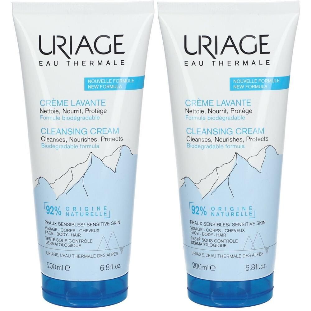 Deux tubes de Crème Lavante Uriage. Tubes blancs avec bouchon bleu. Texte: Crème Lavante, 92% origine naturelle, Uriage Eau Thermale.