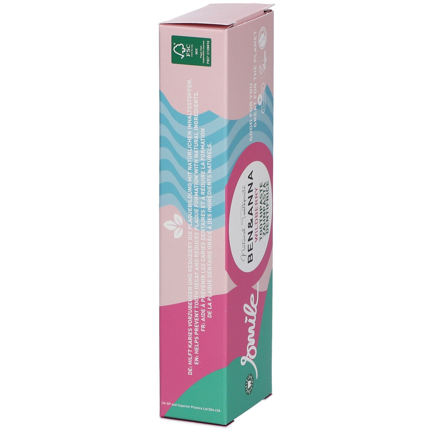 Emballage de dentifrice en biais. Design rose et blanc avec nom et logo du produit. Texte multilingue.