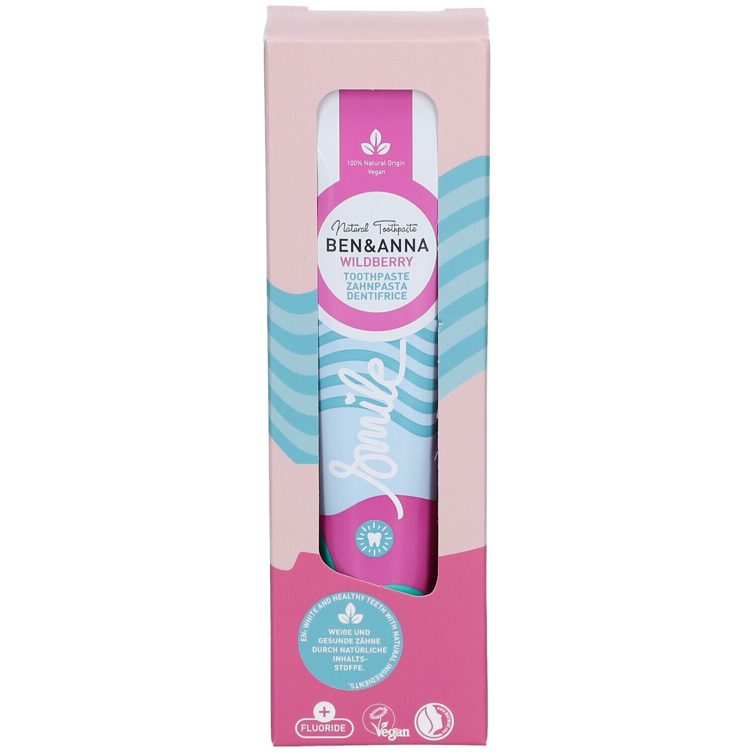 Dentifrice dans son emballage. Design rose et blanc avec nom et logo du produit. Tube visible avec motif vagues bleu et rose.
