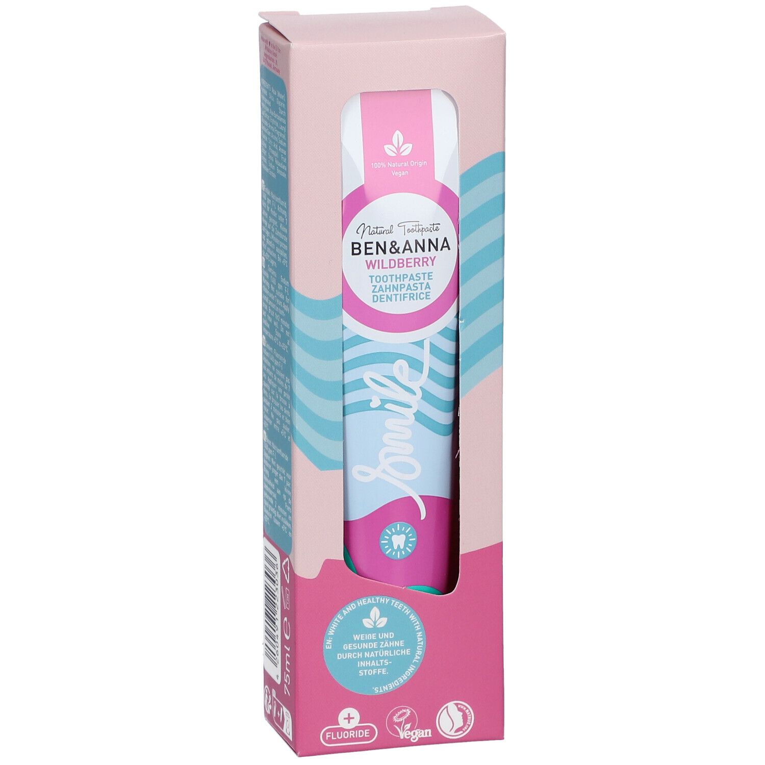Dentifrice dans son emballage. Design rose et blanc avec nom et logo du produit. Tube visible avec motif vagues bleu et rose.
