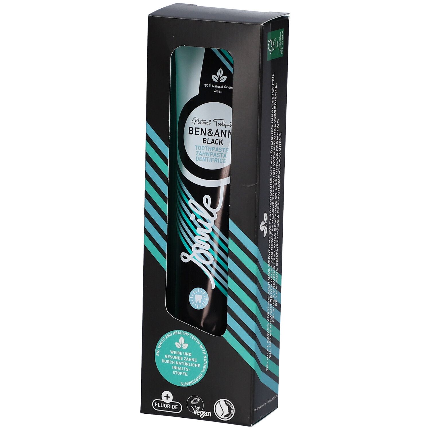 Tube de dentifrice noir dans une boîte noire avec fenêtre. Marque : Ben & Anna. Inscription : Smile, Fluorure, Vegan.