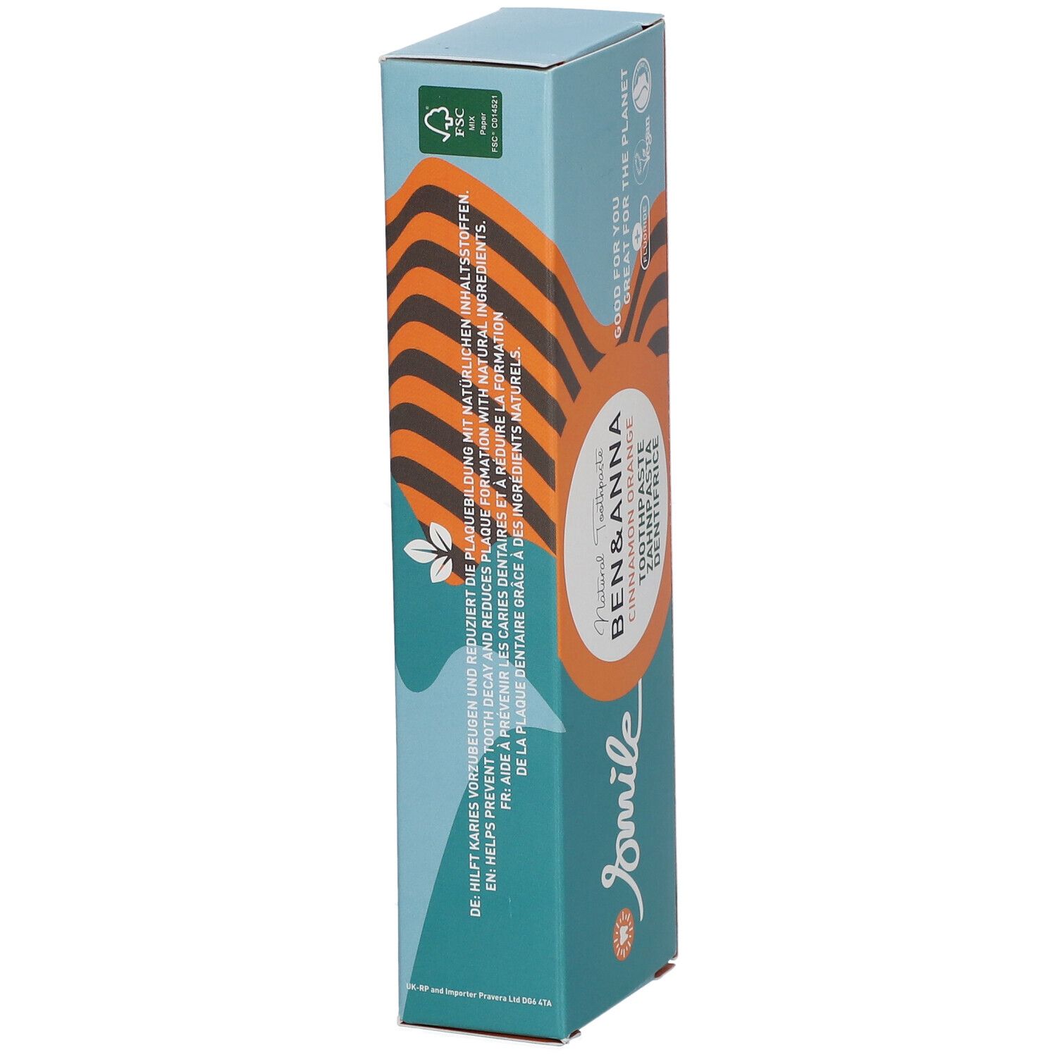 Boîte de dentifrice. Marque Ben & Anna, saveur Cinnamon Orange. Texte: 'Aide à prévenir les caries'. Label Vegan, symbole fluor.