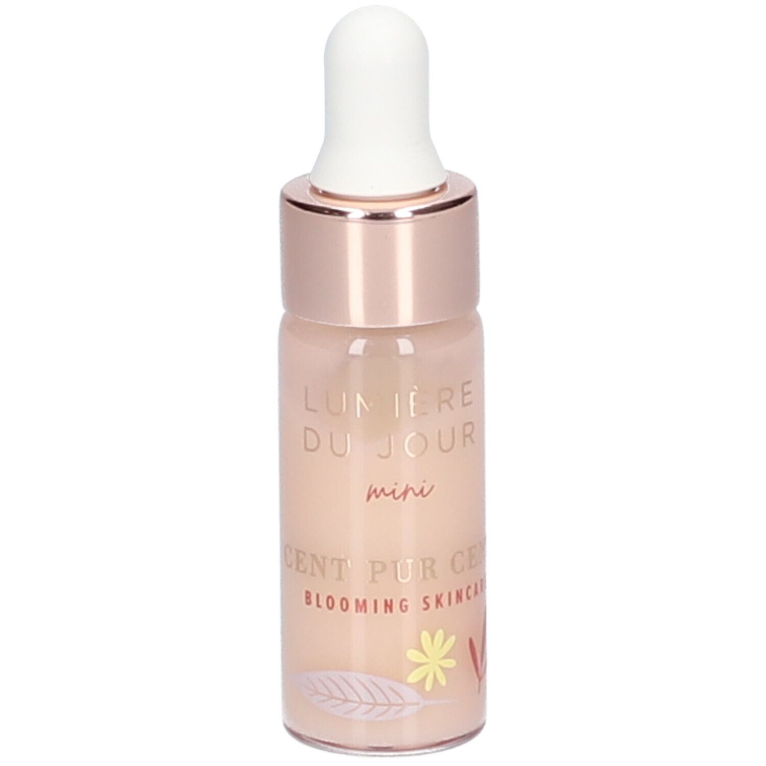 Petite bouteille avec pipette. Inscription : Lumière du Jour mini, Cent Pur Cent Blooming Skincare. Éléments décoratifs.