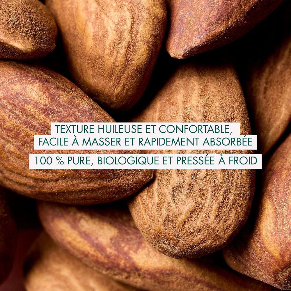 Gros plan d'amandes. Texte: Texture huileuse et confortable, 100% pure, biologique.
