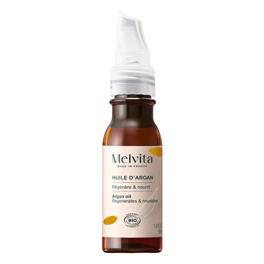 Flacon d'huile d'argan Melvita avec applicateur, vue de face. "Régénère & nourrit".