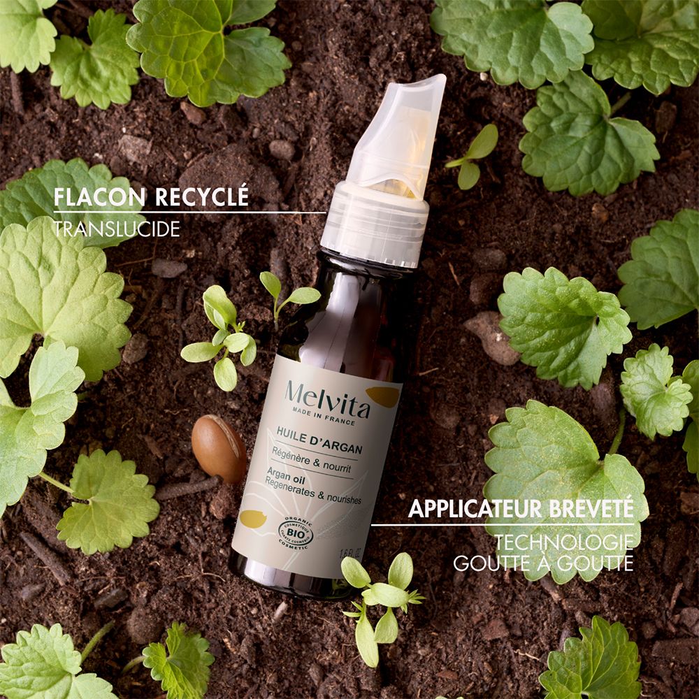 Flacon d'huile d'argan Melvita avec applicateur, vue de face. "Bio".
