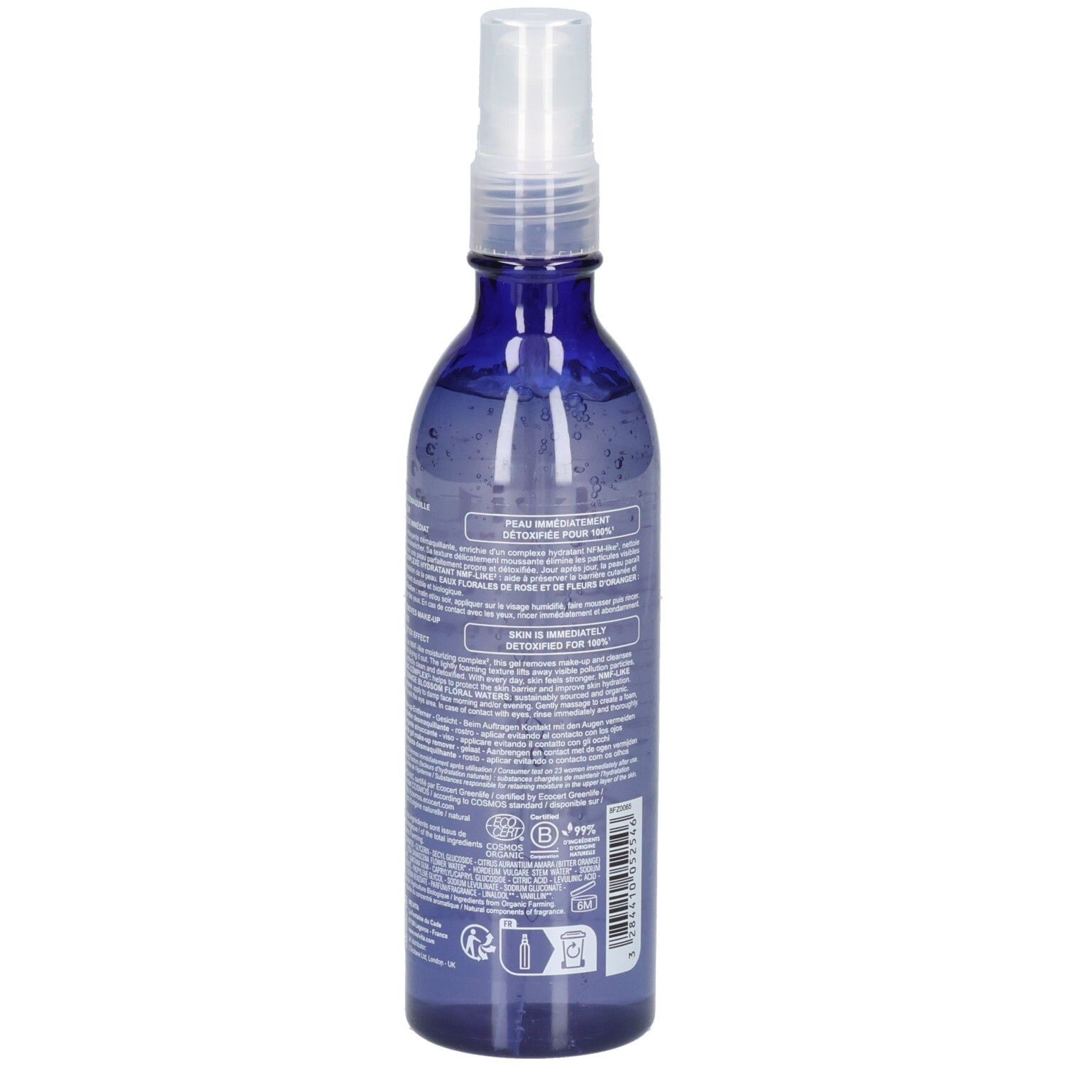 Arrière Melvita démaquillant, flacon spray bleu avec texte et sceaux.
