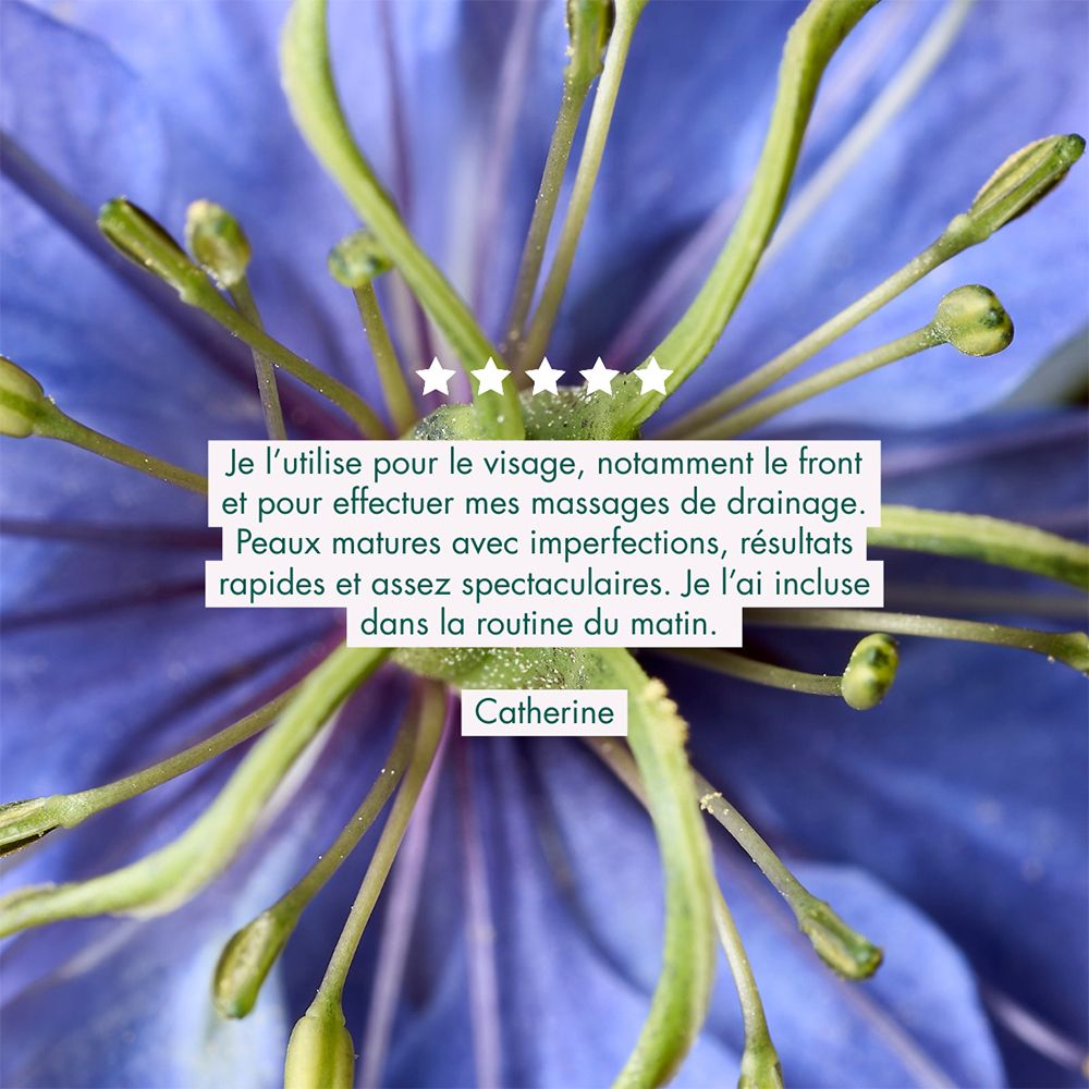 Flacon d'huile de Nigelle Melvita, vue de côté. Texte en français pour une peau plus nette.