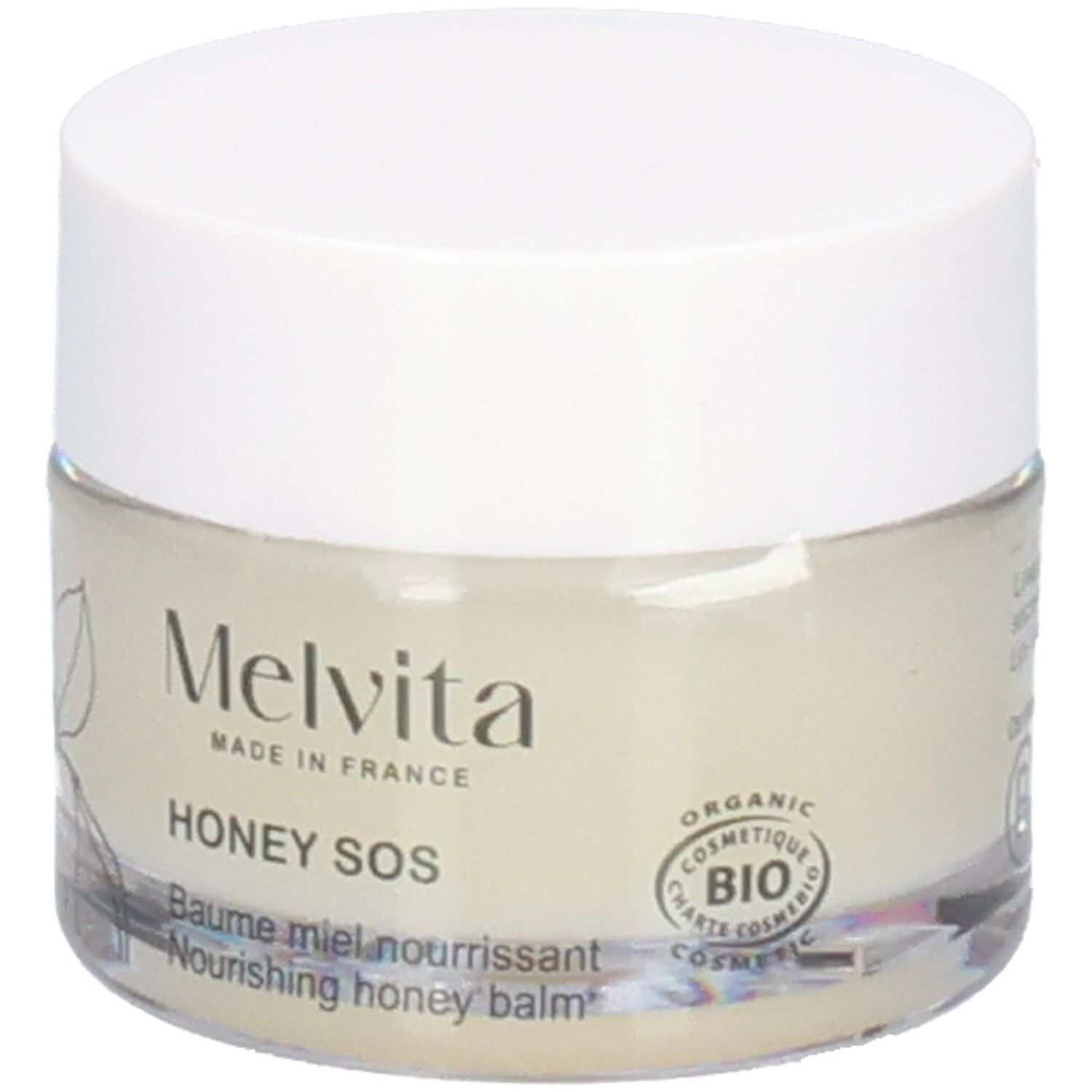 Melvita Baume Miel SOS: Pot en verre avec couvercle blanc. Face avant avec dessin végétal et sceau BIO.