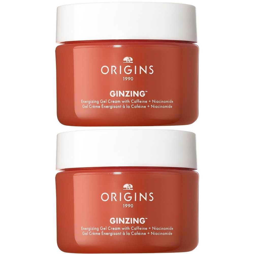 Deux pots de crème gel énergisante ORIGINS GinZing™. Pots rouges avec couvercles blancs. Texte : ORIGINS, GINZING™, Crème gel énergisante.