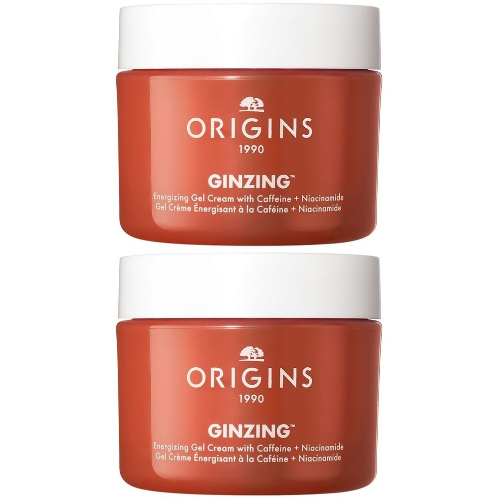 Deux pots de crème gel énergisante ORIGINS GinZing™. Récipient rouge avec couvercle blanc. Nom et détails du produit sur l'étiquette.