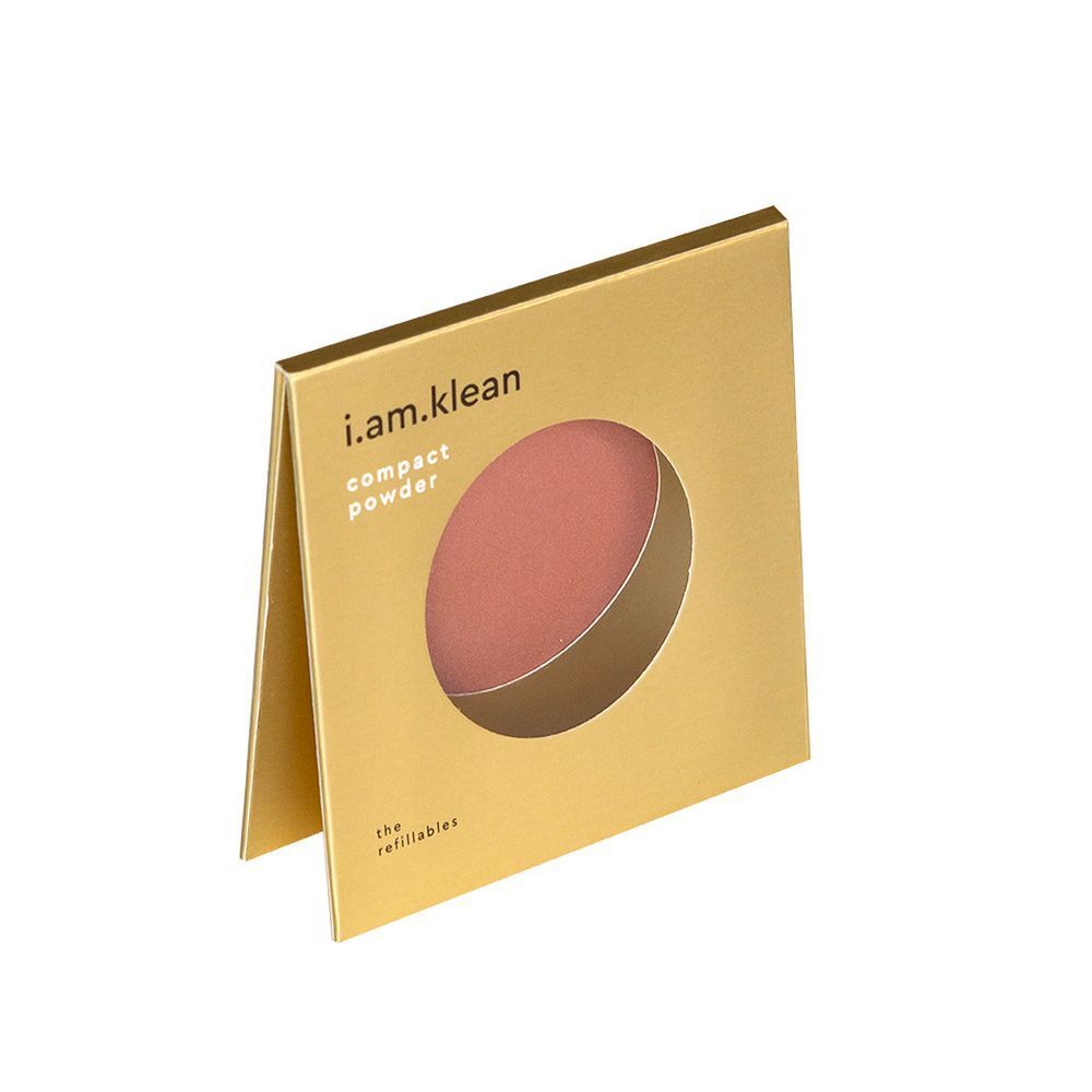 Emballage doré, semi-ouvert. Blush rose visible. Marque : i.am.klean. Texte : "compact powder".