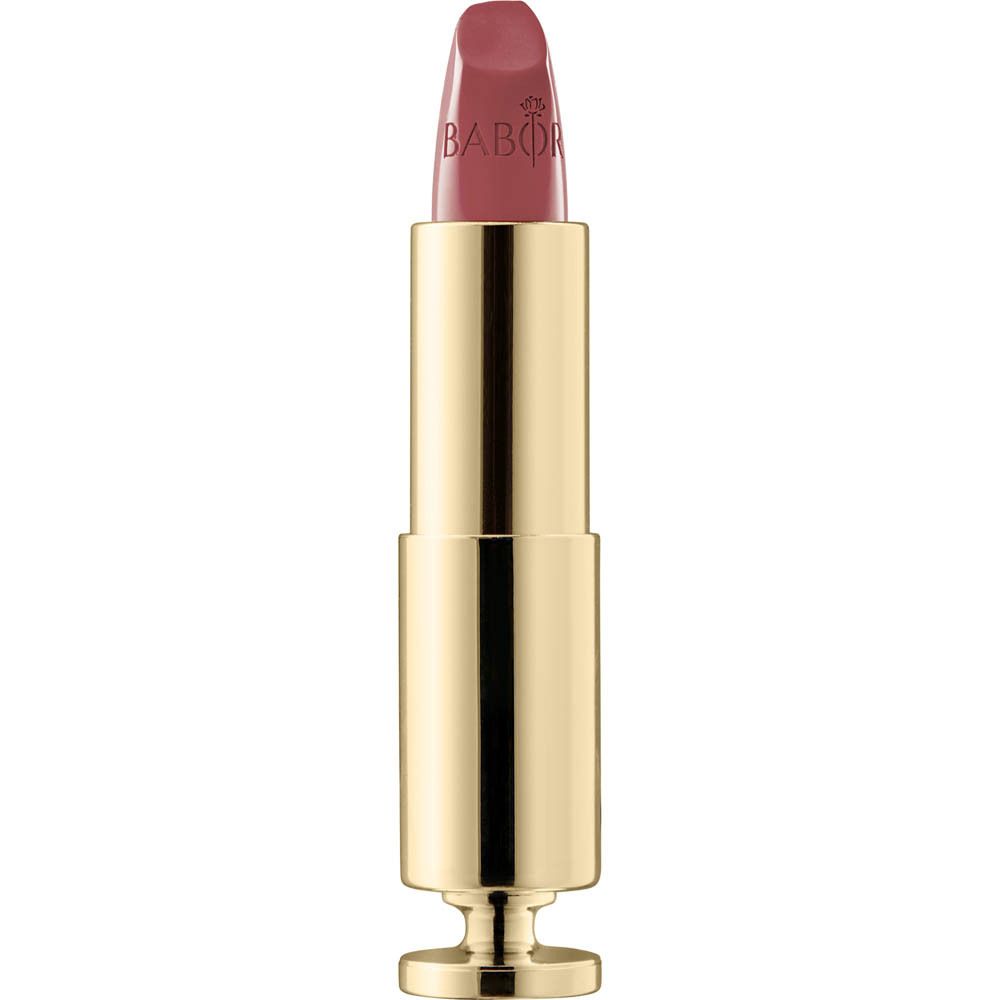 Rouge à lèvres doré, ouvert. Le rouge à lèvres est rose.