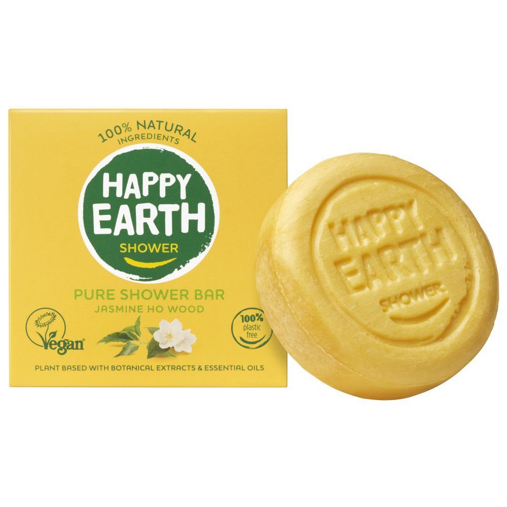 Boîte jaune et savon rond. Sur la boîte : HAPPY EARTH SHOWER, Pure Shower Bar, Jasmin Ho Wood.