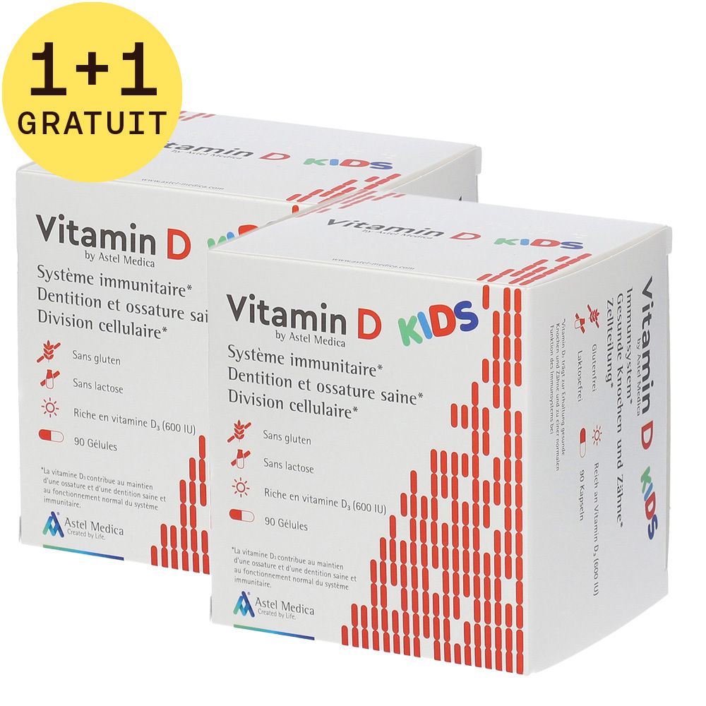 Deux boîtes blanches avec motif rouge et texte: Vitamin D KIDS. Autocollant 1+1 GRATUIT. Contient 90 gélules. Système immunitaire, Dentition et ossature saine, Division cellulaire.