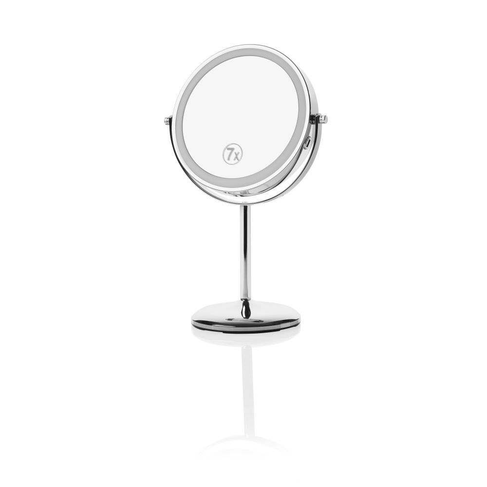 Miroir cosmétique avec grossissement 7x. Rond, argenté, avec pied.