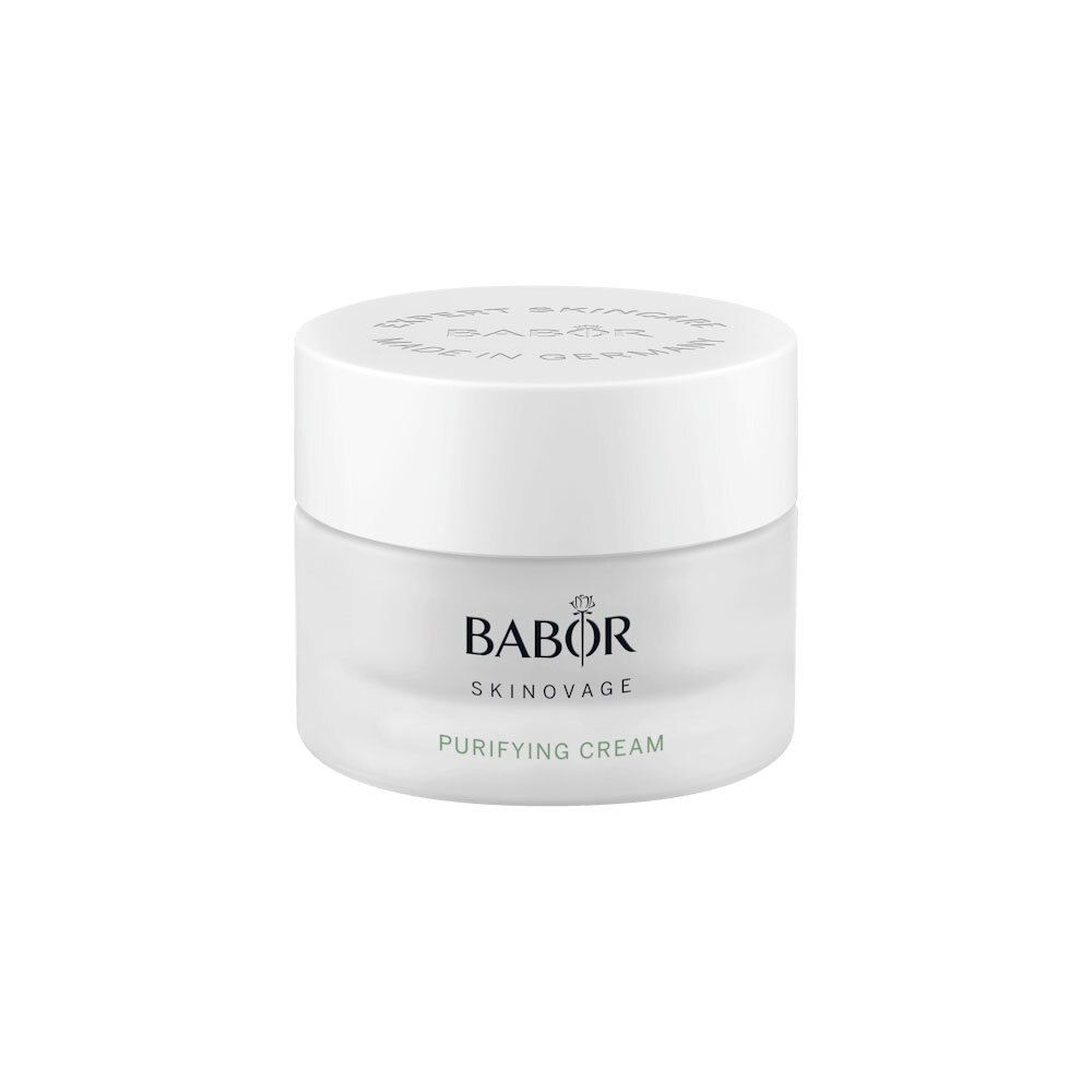 Pot de crème avec couvercle blanc. BABOR SKINAVAGE PURIFYING CREAM est écrit sur le pot.