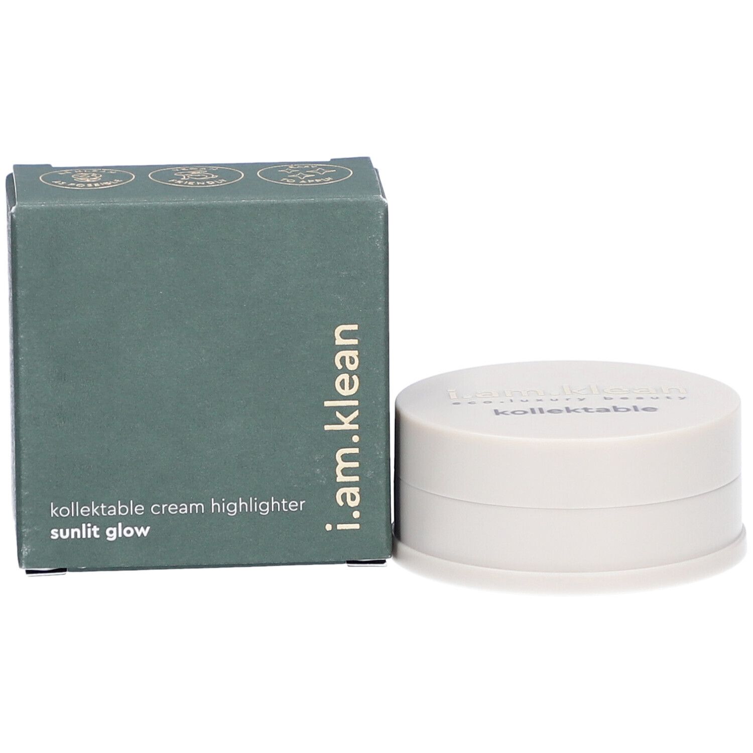 Boîte verte et contenant crème. La boîte porte i.am.klean, kollektable cream highlighter sunlit glow. Le contenant a un couvercle avec texte.