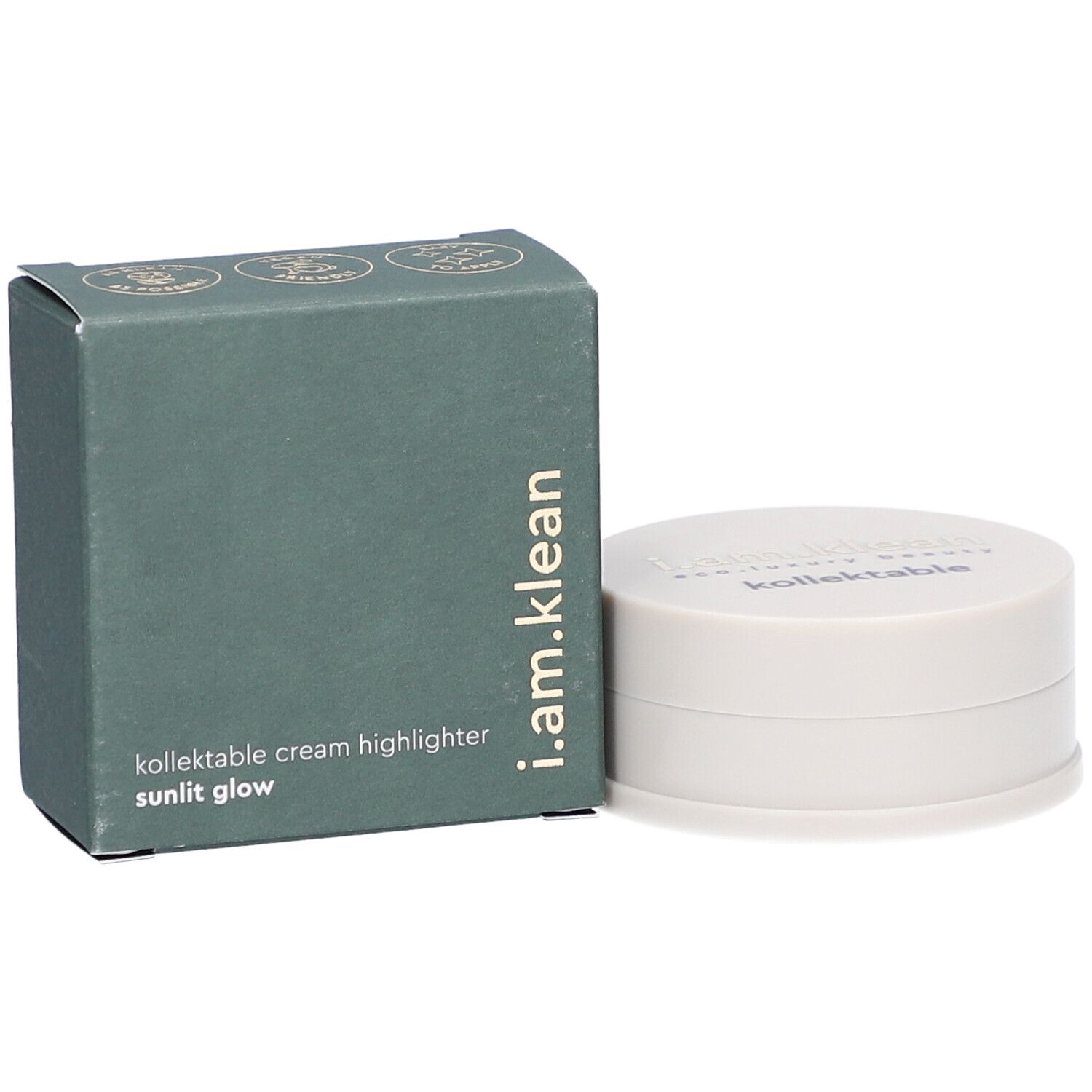 Boîte verte et contenant crème. La boîte porte i.am.klean, kollektable cream highlighter sunlit glow. Le contenant a un couvercle avec texte.