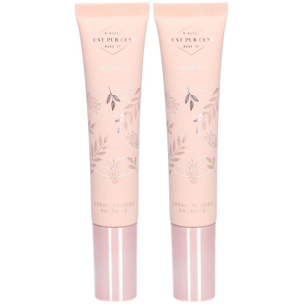 Deux tubes de crème rose-beige, texte et motif floral. Bouchons roses. Inscription: Cent Pur Cent, Nomige, Crème Teintée Parfaite.