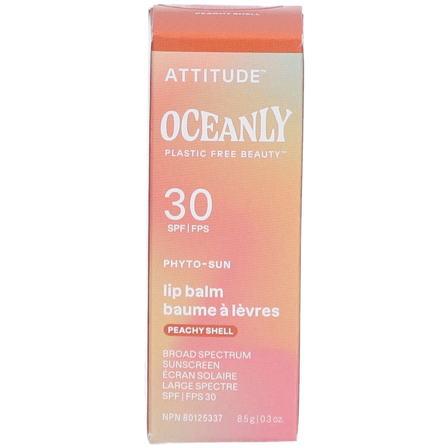 Boîte de baume à lèvres. Marque : Attitude Oceanly. Texte : 30 SPF, Peachy Shell. Sans plastique. Fond dégradé.