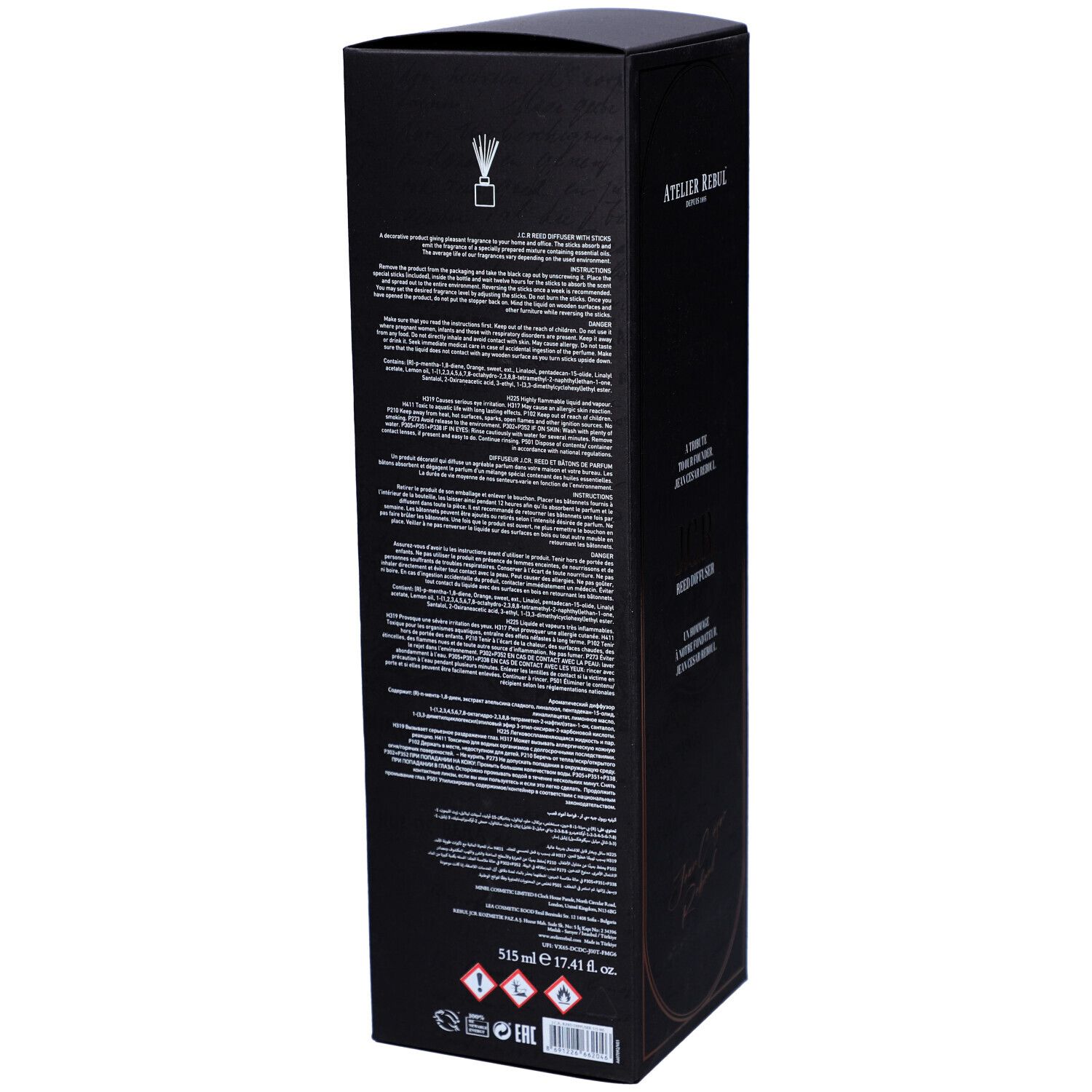 Boîte noire avec texte. Texte : 515 ml 17.41 fl. oz. Pictogrammes de danger. Atelier Rebul. Arrière de la boîte.