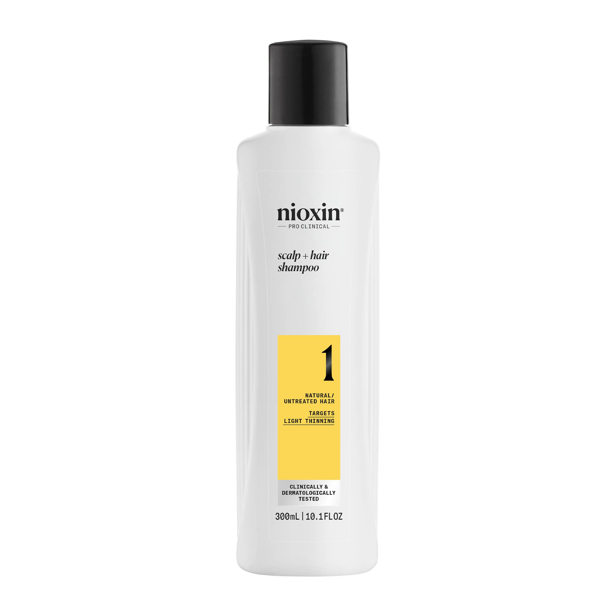 Flacon blanc, bouchon noir. Inscriptions: Nioxin, Scalp & Hair Shampoo, 1. Zone jaune avec texte. 300ml.