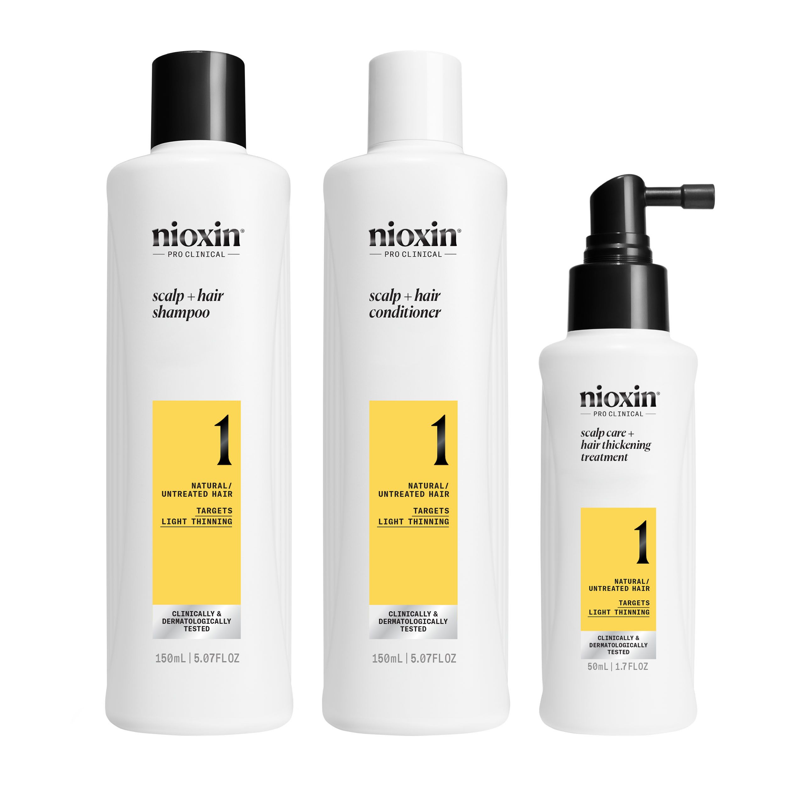 Trois produits Nioxin : shampooing, après-shampoing et traitement. Flacons blancs avec étiquettes jaunes.