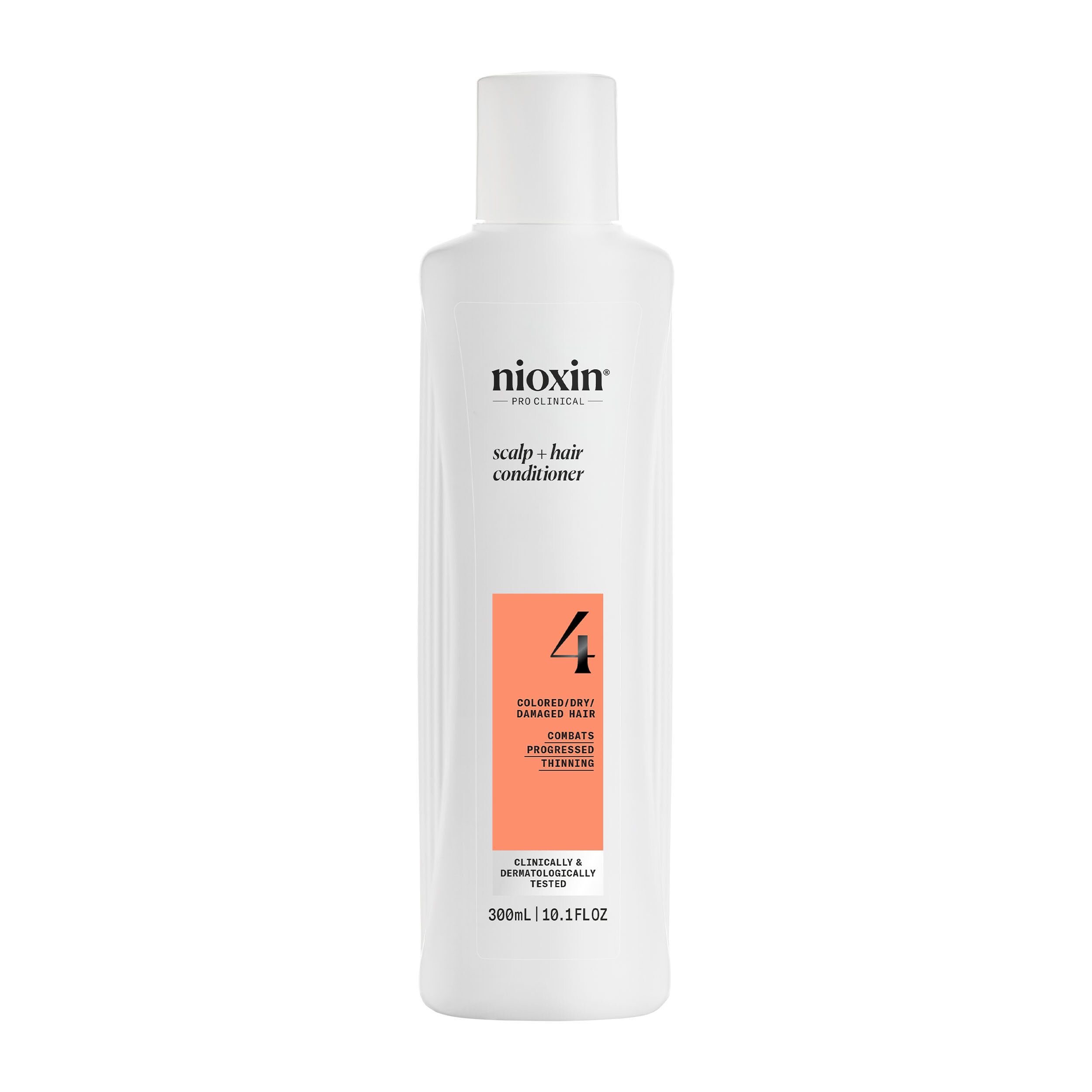 Flacon blanc de revitalisant Nioxin. Étiquette orange avec texte. 300 ml. Pour cheveux colorés et clairsemés.