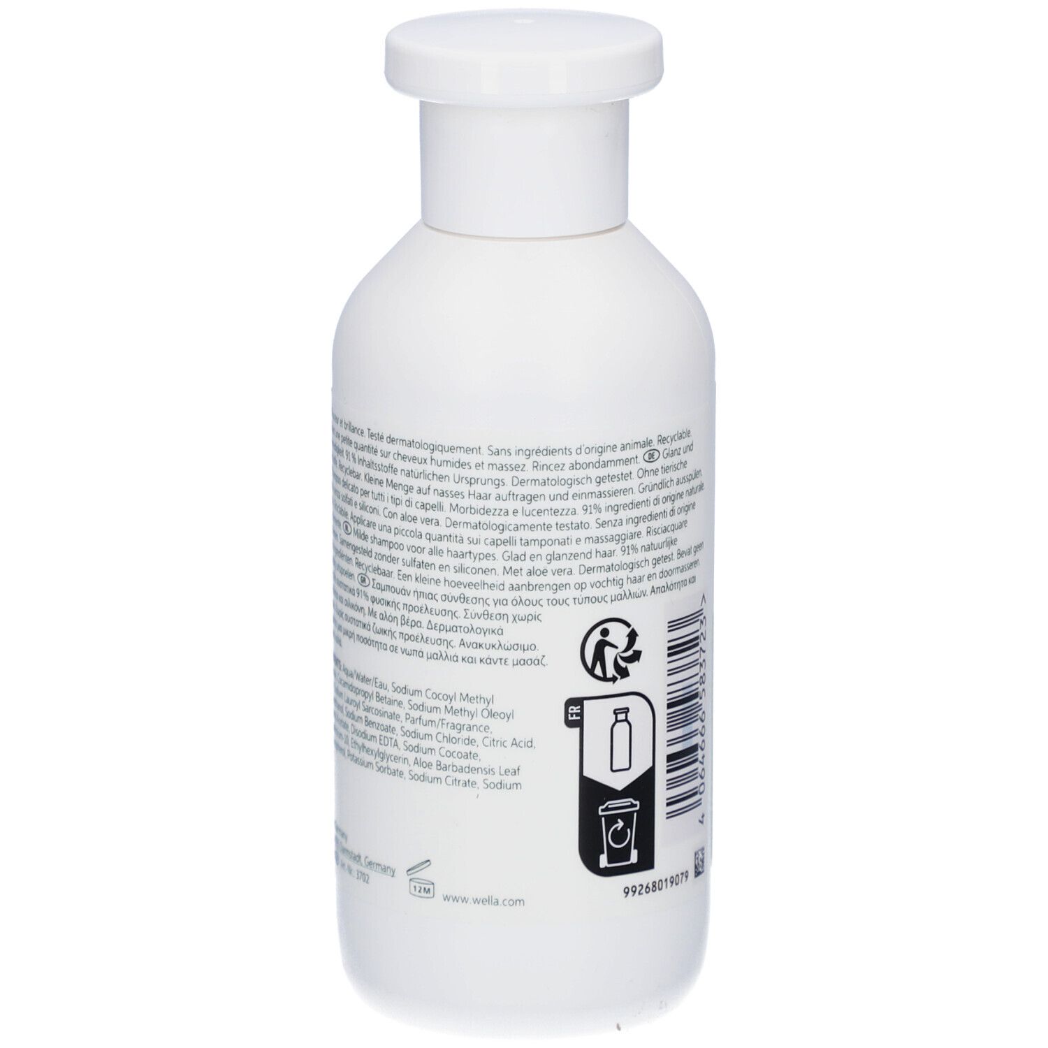 Dos du flacon de shampooing blanc. Texte sur l'étiquette. Ingrédients, symbole de recyclage et code-barres.