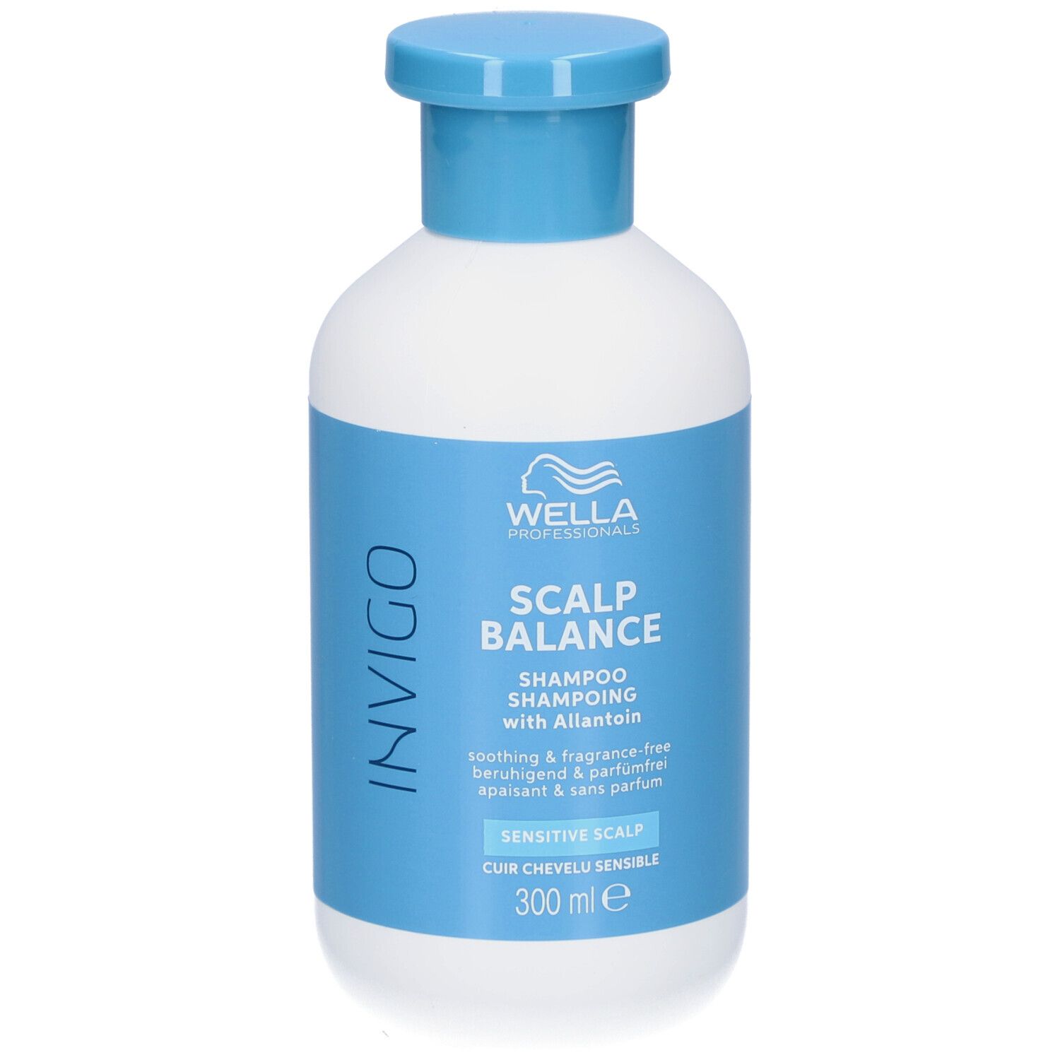 Flacon blanc, bouchon bleu. Inscriptions: INVIGO, SCALP BALANCE, Shampooing, Cuir chevelu sensible. 300 ml.