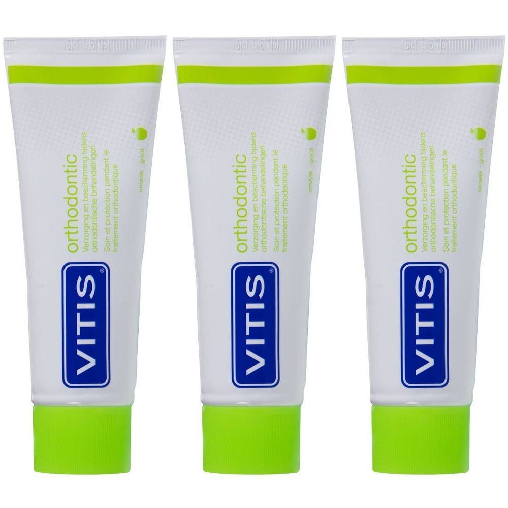 Trois tubes de dentifrice. Blanc, avec bouchon et bande verts. Inscription : VITIS orthodontic.