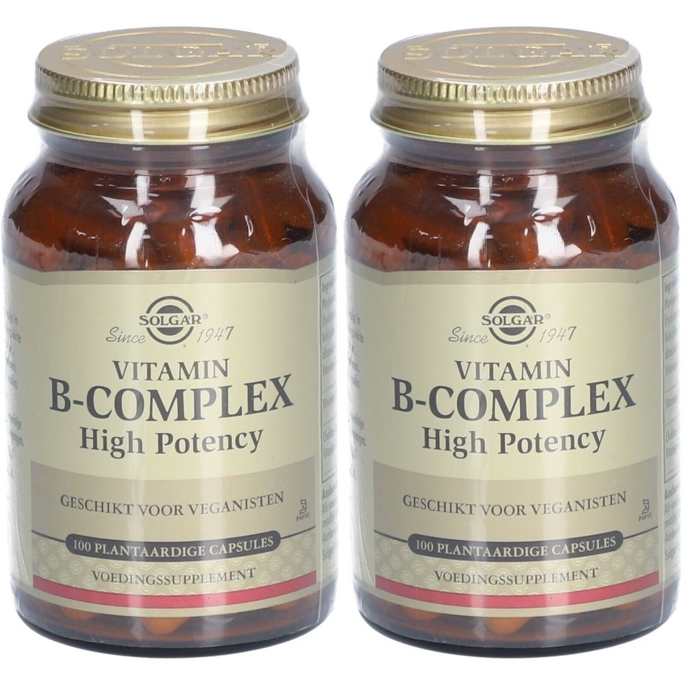 Deux flacons en verre brun avec couvercles dorés. Inscription : Vitamin B-Complex, High Potency. Convient aux végétaliens.