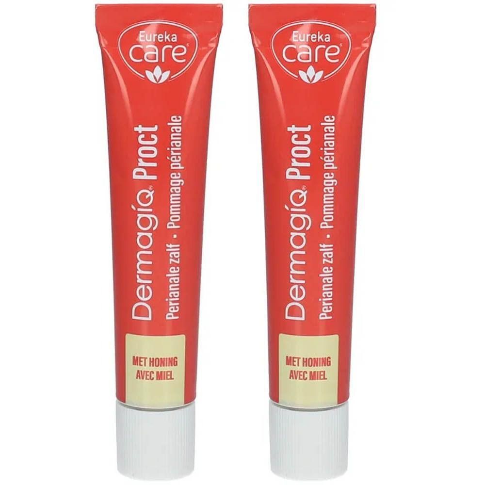 Deux tubes de crème DermagíQ Proct. Tubes rouges avec bouchon blanc. Inscription: Eureka Care, miel.