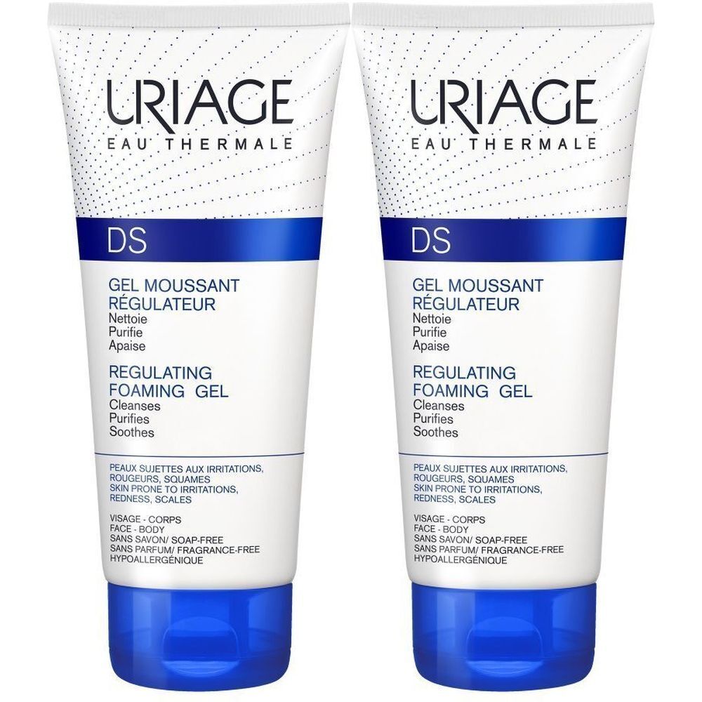 Deux tubes de Gel nettoyant Uriage DS. Inscription: Gel moussant régulateur, Regulating Foaming Gel. Blanc, bleu et noir.