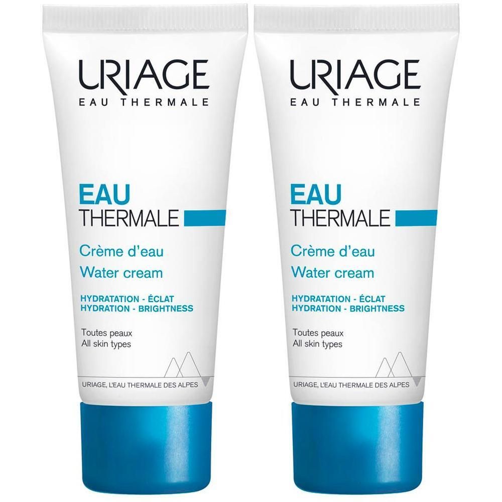Deux tubes de crème d'eau Uriage Eau Thermale. Tubes blancs avec texte et bande bleus. Texte: Eau Thermale, Water cream.