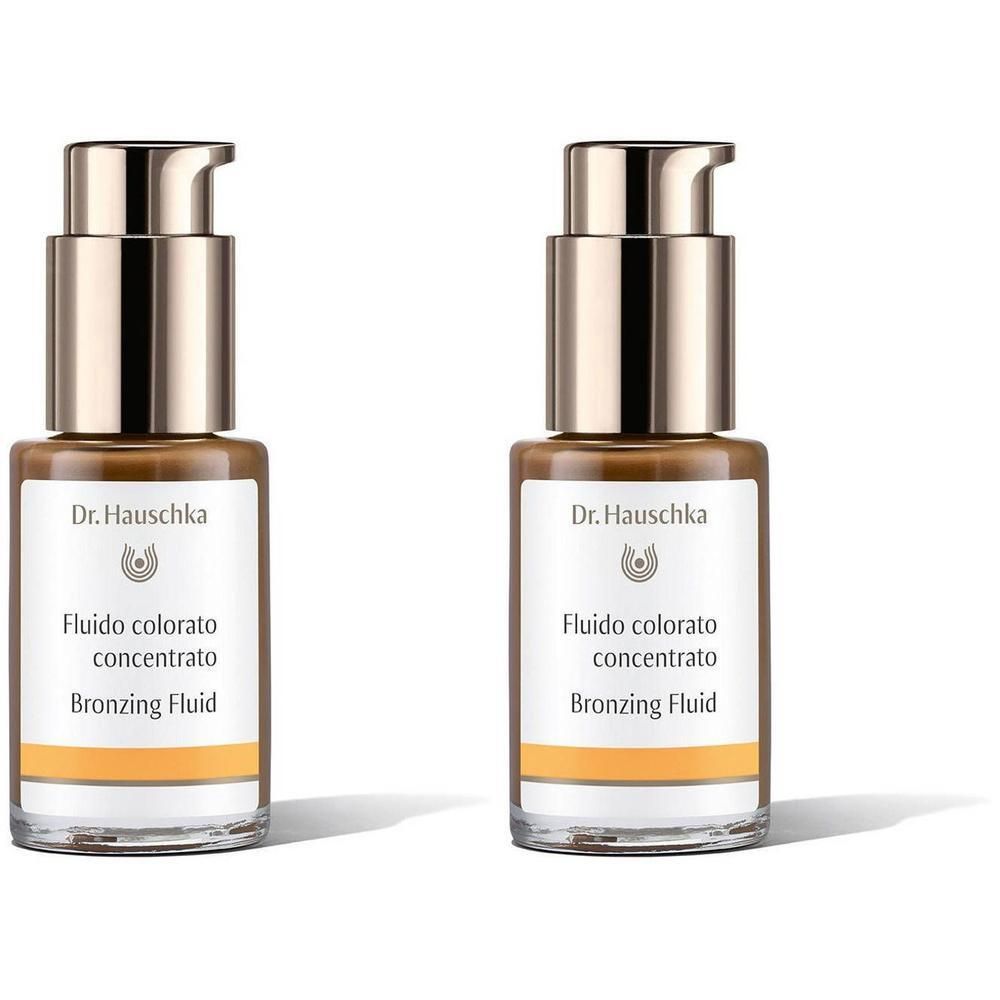 Deux flacons de fluide bronzant. Flacons en verre avec pompes dorées et étiquettes avec nom du produit.