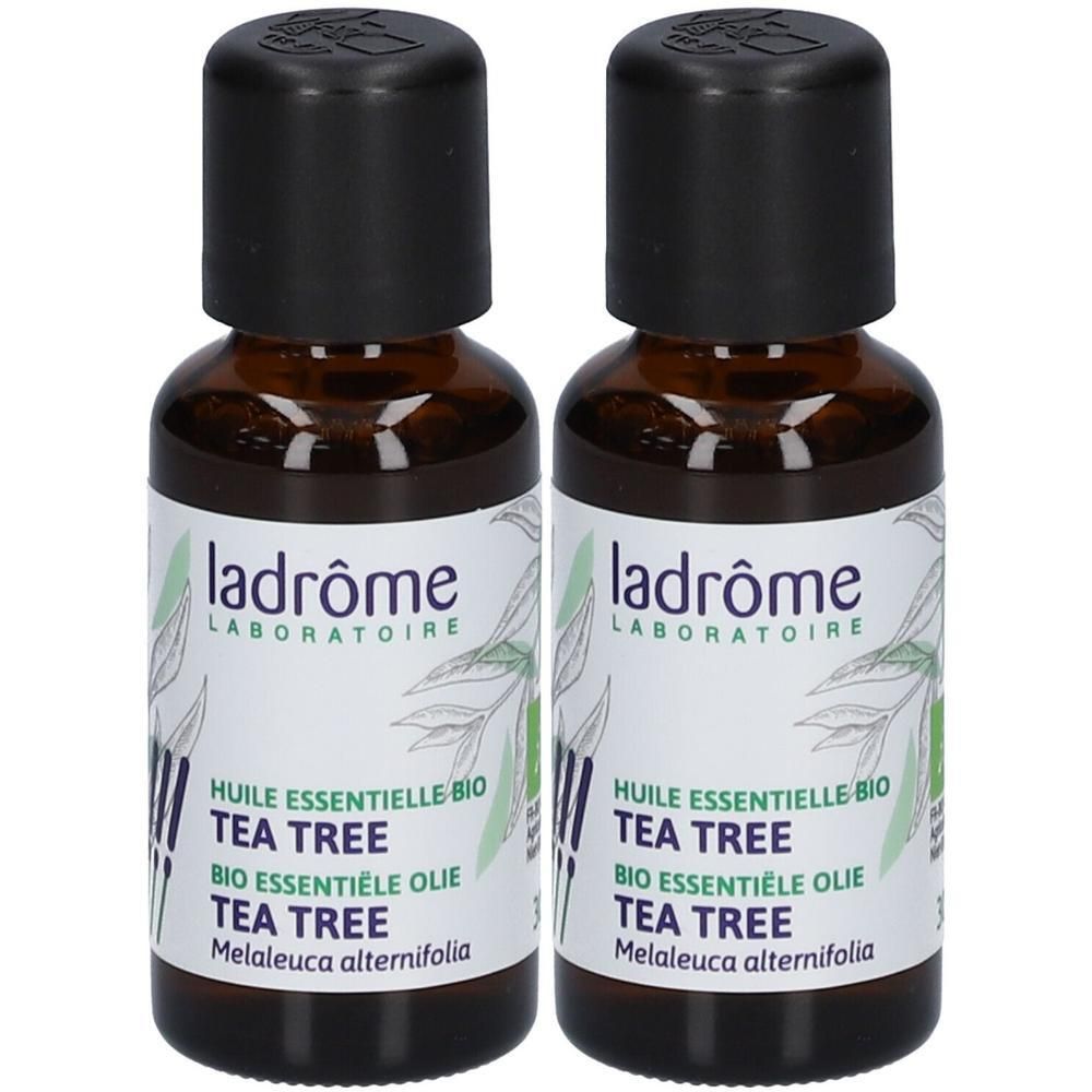 Deux flacons en verre brun avec bouchon noir. Étiquette avec texte : Ladrôme, Tea Tree Bio, huile essentielle.
