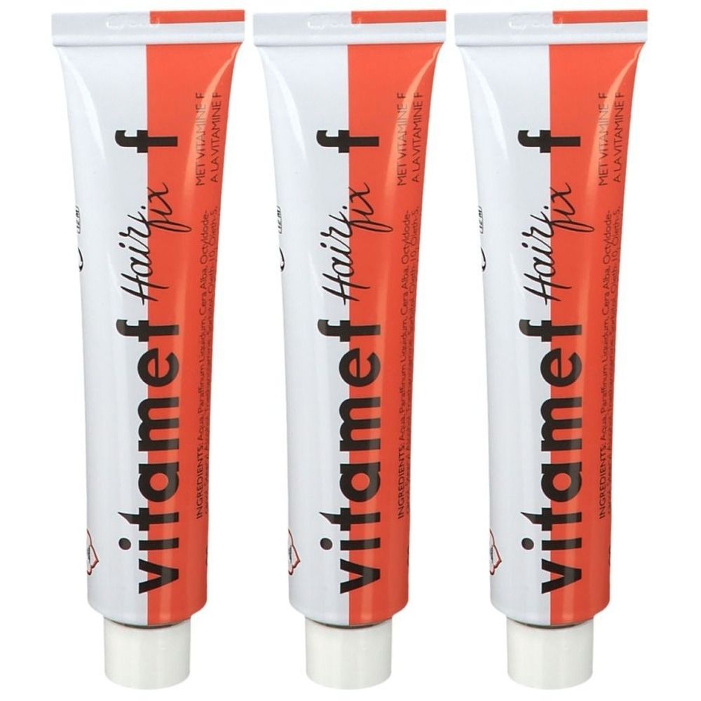 Trois tubes de Vitamef Hairfix. Tubes blancs avec bande rouge et texte. Contient des ingrédients et un symbole de danger.