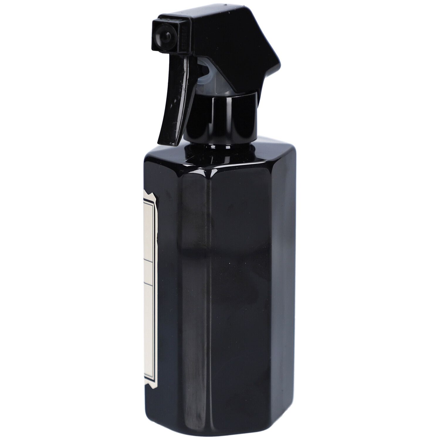Flacon pulvérisateur noir, vue latérale. Étiquette partiellement visible.