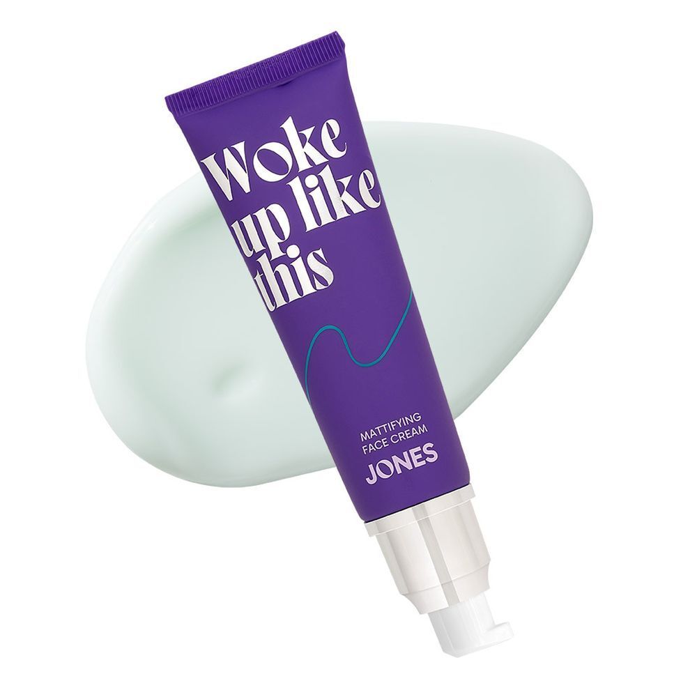 Tube violet avec bouchon argenté et échantillon de produit. Inscription : Woke up like this. Marque : JONES.